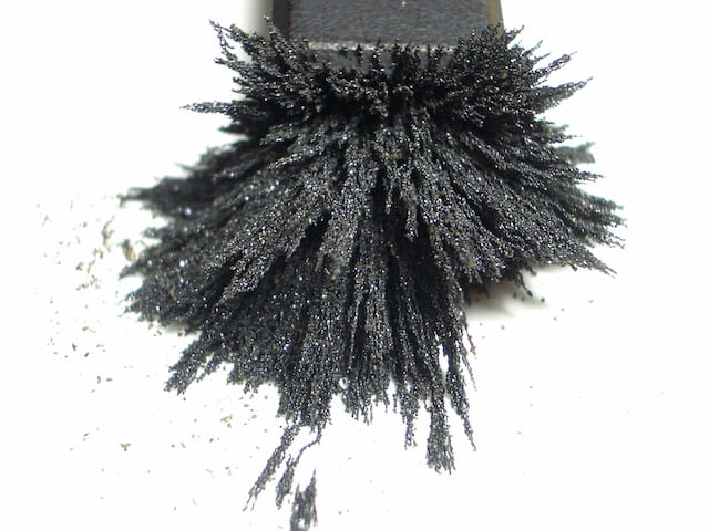 Metal powder attracted to magnet